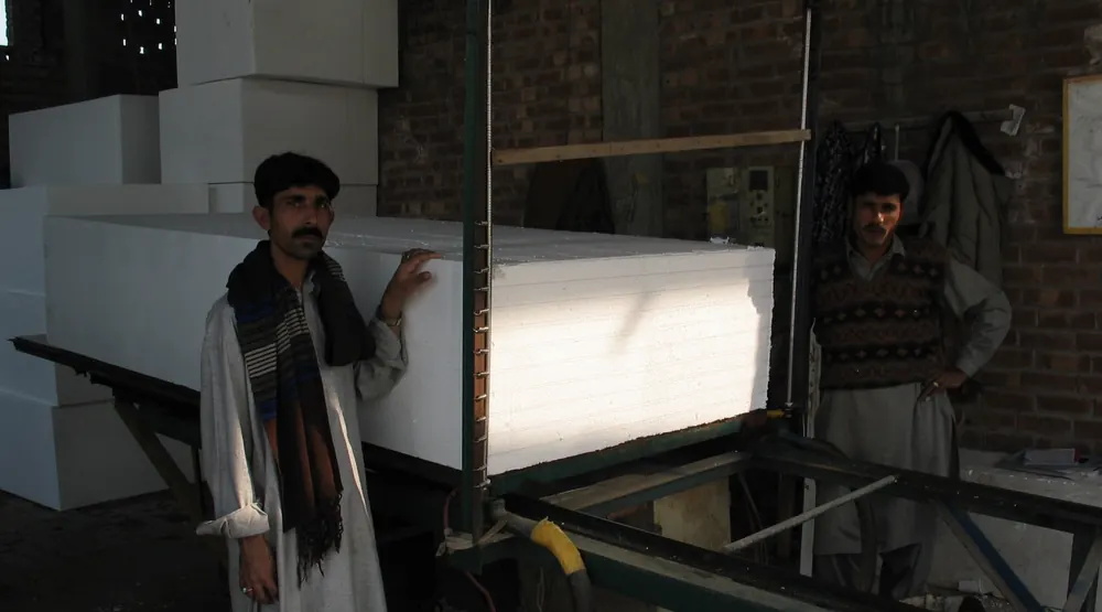 TKG team at the EPS cutting machine, North Karachi factory