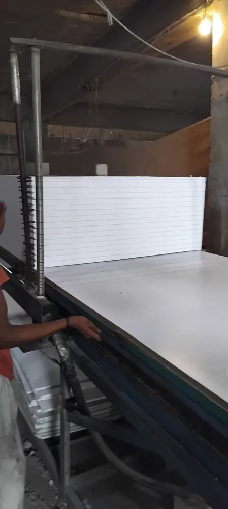TKG factory worker cutting EPS sheets